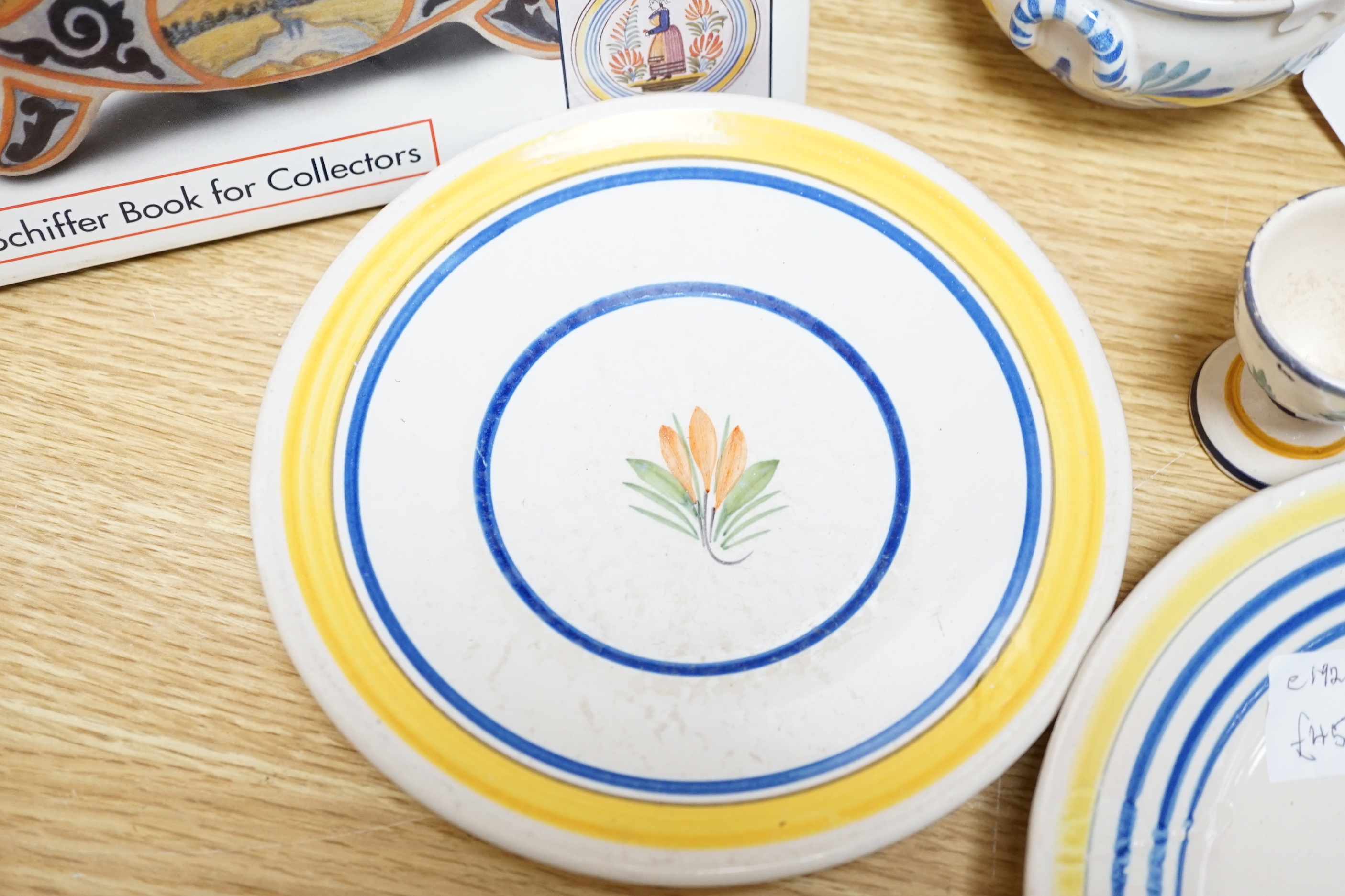 A group of Quimper pottery and a Quimper Pottery book by Angela Meadows